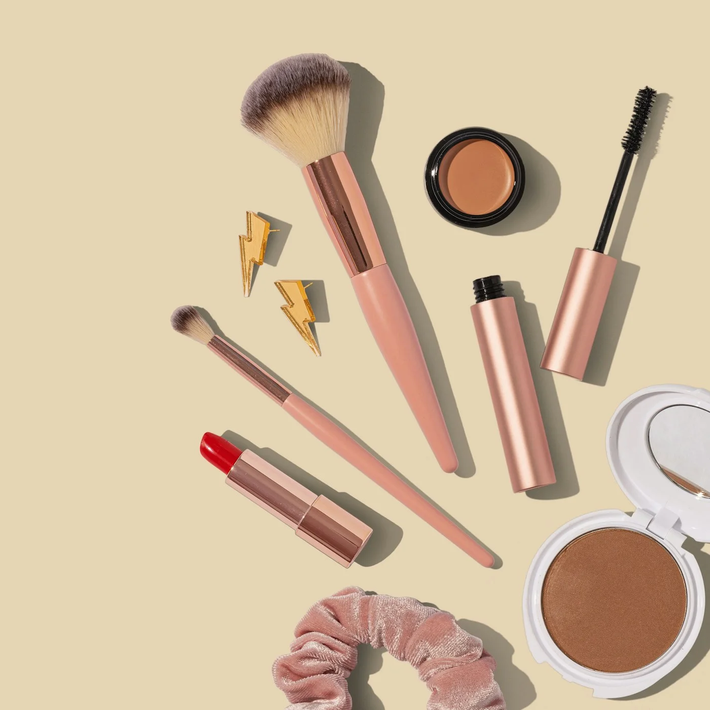 Makeup products and brushes arranged for an everyday routine