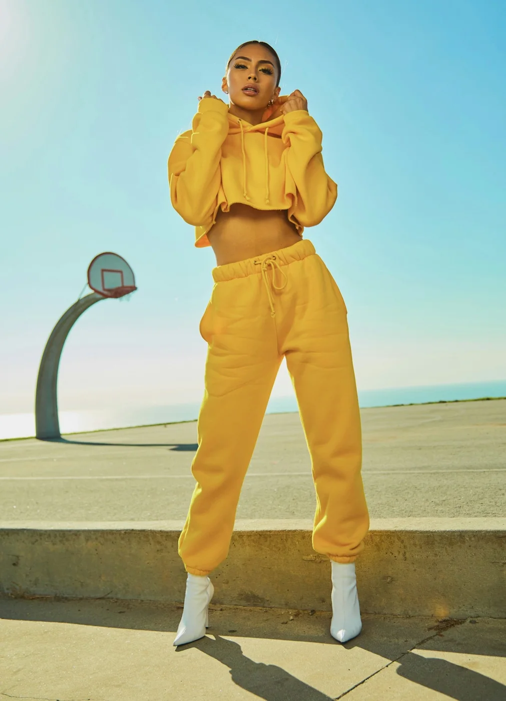Woman wearing a yellow outfit outdoors
